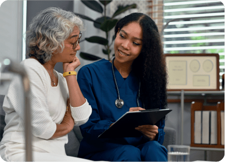 A healthcare worker and patient in discussion.